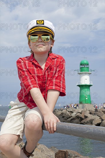 Young boy with a captain's hat