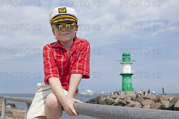 Young boy with a captain's hat