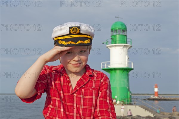 Young boy with a captain's hat