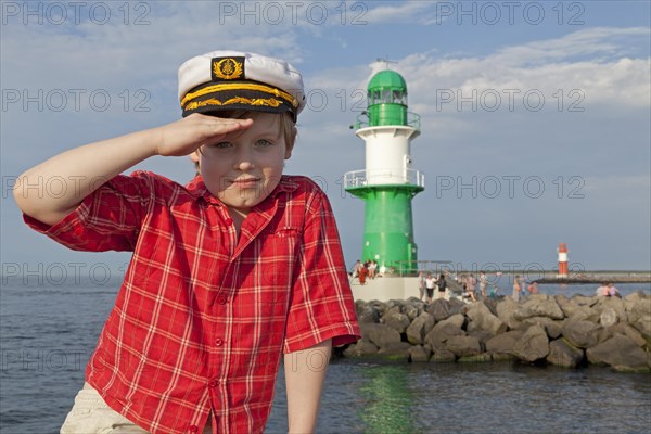 Young boy with a captain's hat