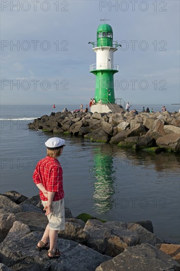 Young boy with a captain's hat