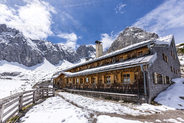 Coburg Hut on lake Drachensee with Grunsteinscharte and Drachenkopf mountains