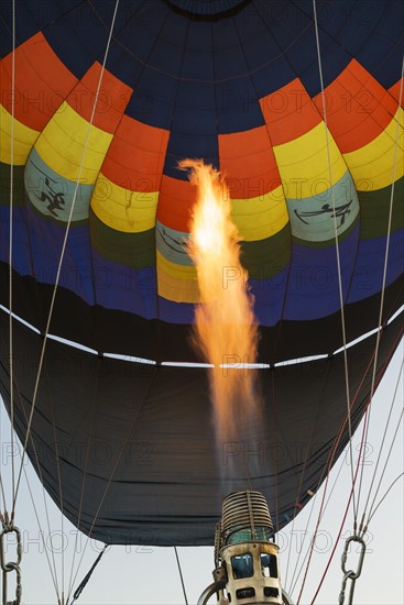 Pilot inflating hot air balloon with two burners