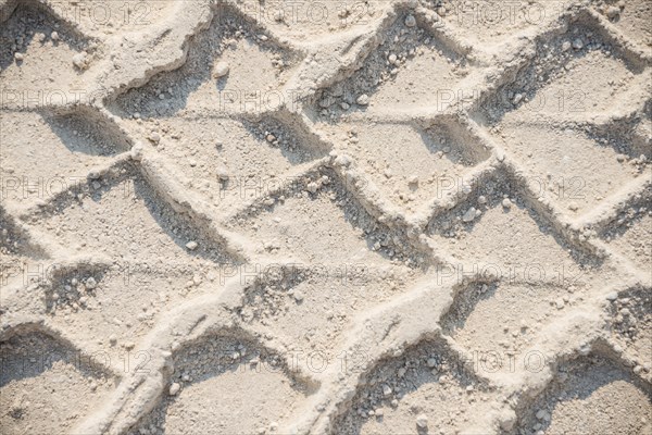 Tire tracks in the sand