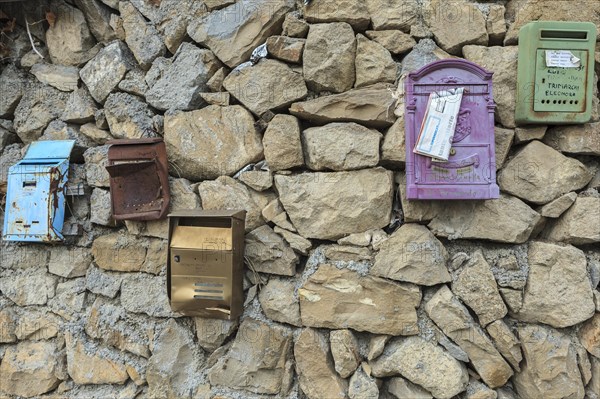 Post boxes on a stone wall