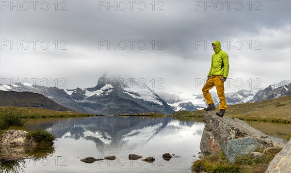 Hiker stands on rock