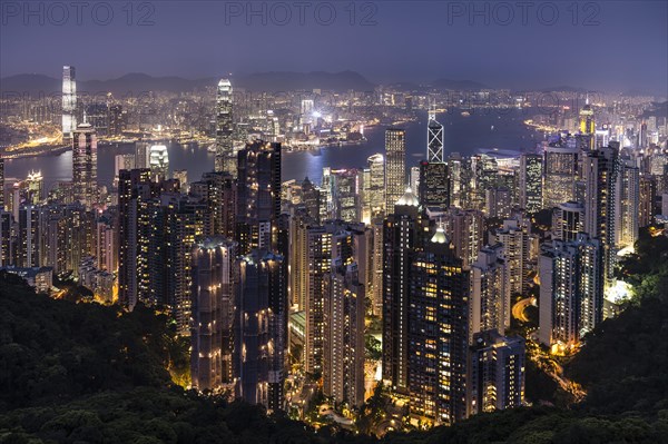 Panoramic view from Victoria Peak across the high-rise buildings at night