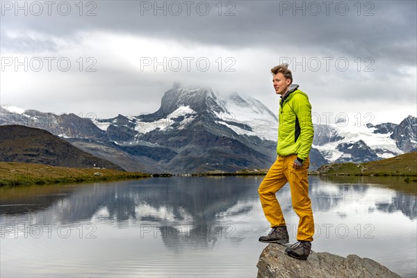 Hiker stands on rock