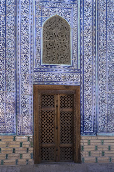 Door and mosaic-decorated wall