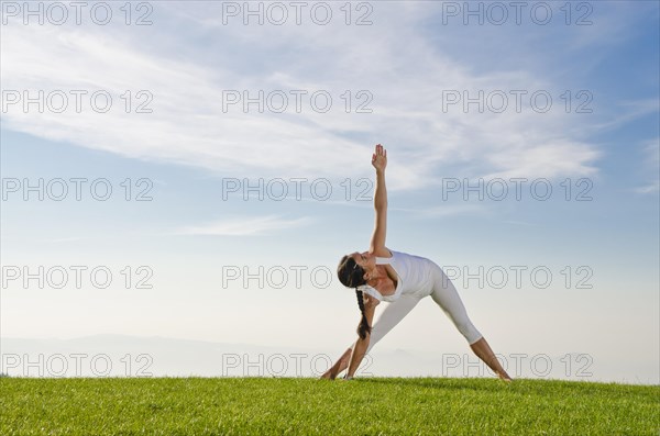 Young woman practising Hatha yoga