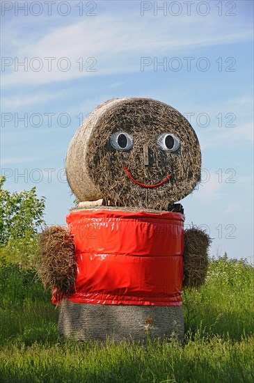 Straw doll made of straw bales