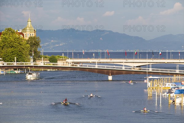 Passenger ship and rowing boats on the Rhine River