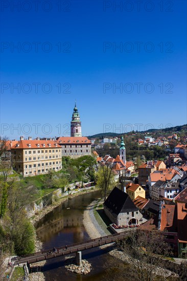 Cesky Krumlov Castle with the castle tower and St. Jost Church