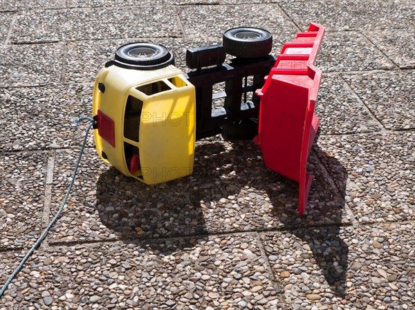 Toppled over toy dumper truck
