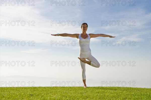 Young woman practising Hatha yoga