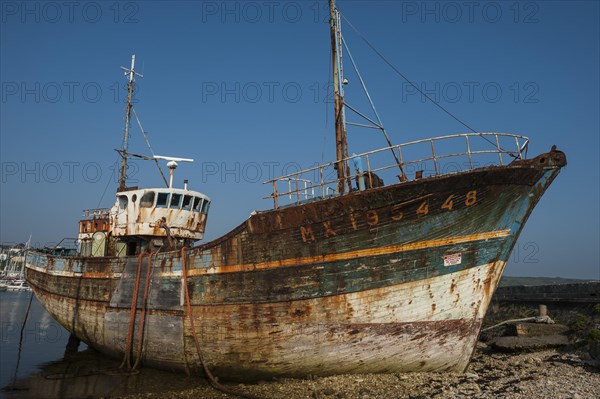 Wreck of an old painted wooden ship
