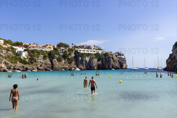 Tourists in the shallow sea