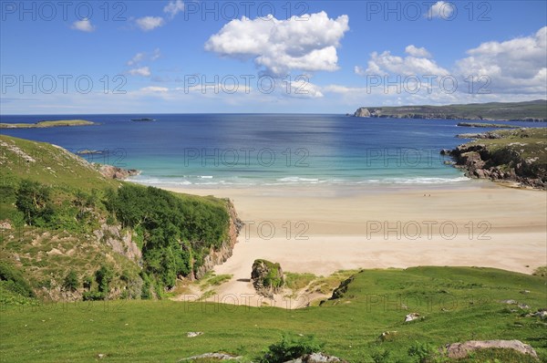 Sandy beach and rocks in Rispond Bay