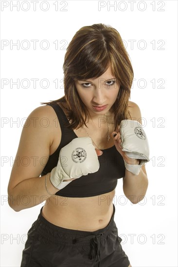 Young woman in sportswear wearing Wing Chun gloves