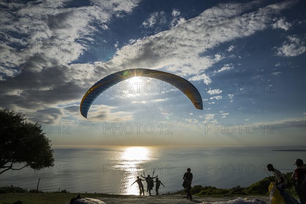 Paraglider at the start to a tandem jump