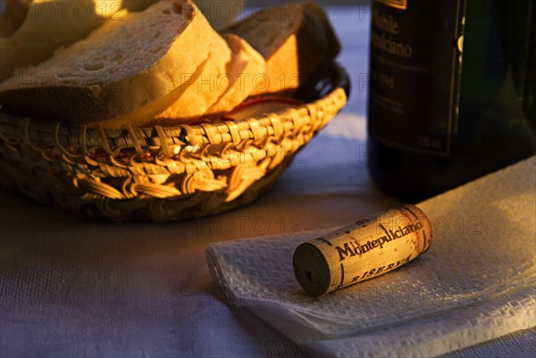 Bread basket with a bottle and a cork
