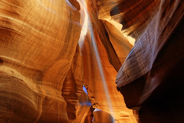 Rays of light falling on yellow-red sandstone formations