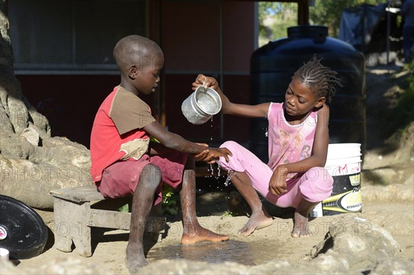 Children washing their hands