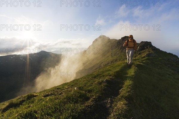 Hiker on the summit of Mt Grosser Galtenberg in the evening light