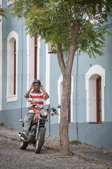 Man sitting on a motorcycle