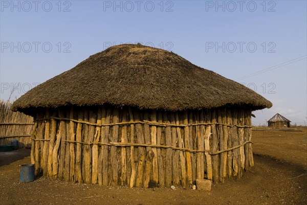 Round hut made of tree trunks