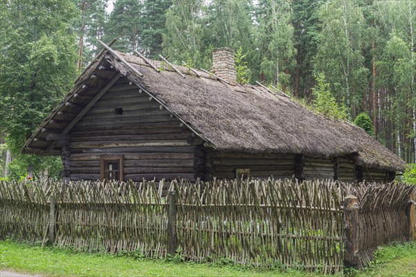 Farmhouse with a wooden fence