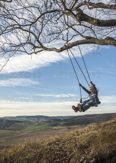 Boy on an improvised swing
