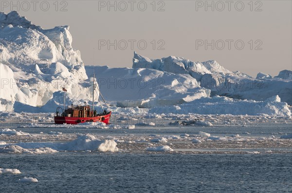 Boat between icebergs