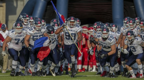 Team France running onto the field for their game against Denmark