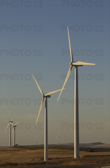 Windmills in the evening light on a wind farm near Sanlucar de Barrameda