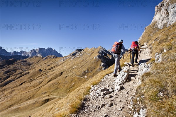 Climbers on the Peitlerscharte pass ascending to Peitlerkofel in Puez-Geisler Nature Park