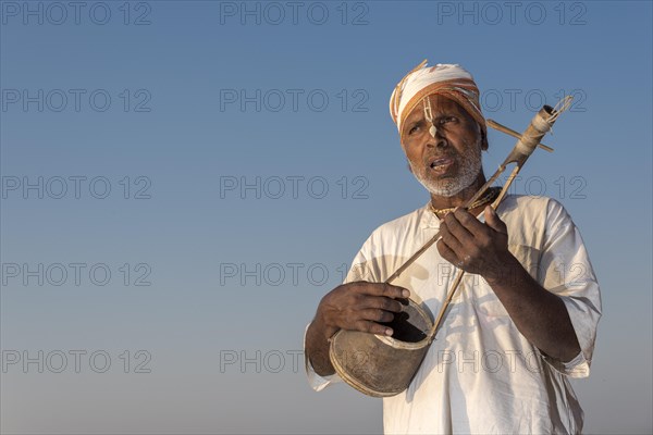 Musician playing an Ektara