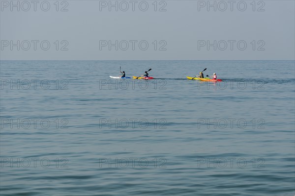Kayakers in the open sea
