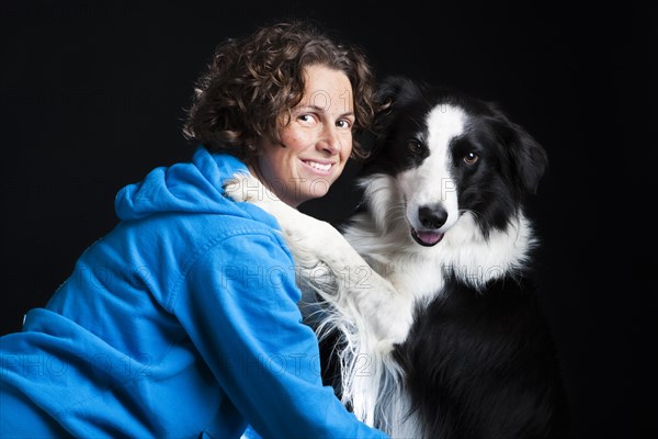 Young woman with a Border Collie