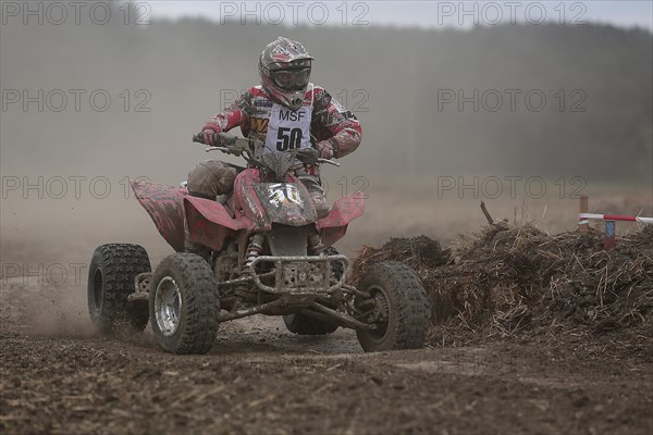 Quad rider on a field