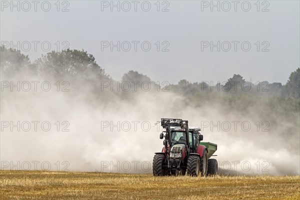 Tractor liming a field