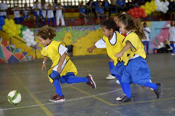 Soccer tournament with children on the sports ground of a slum