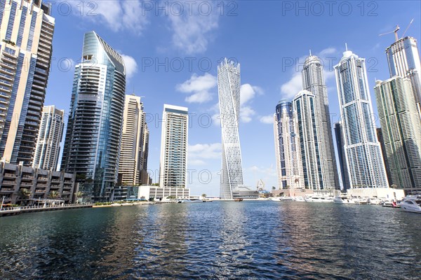 Cayan Tower and skyscrapers with marina