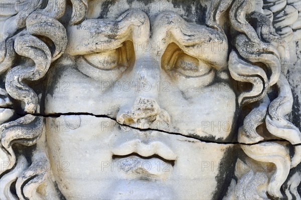 Antique Medusa or Gorgon head at the Apollon temple