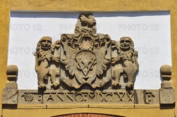 The coat of arms of the Dutch East India Company above the Portuguese Gate