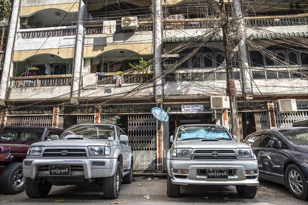 Vehicles parked in front of a residential building