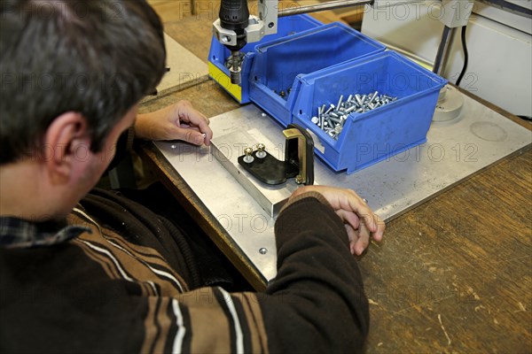 Mentally and physically disabled man at work