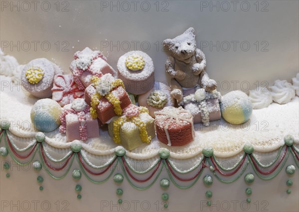 Christmas gifts and a teddy bear made of marzipan