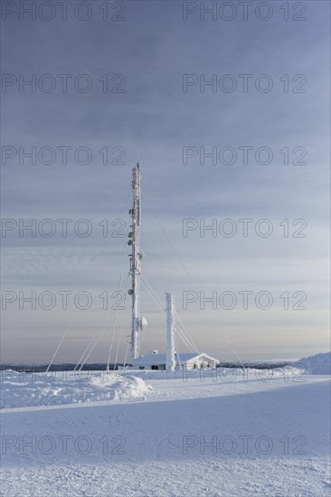 Snow-covered radio tower