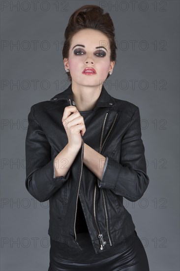 Young woman wearing a leather outfit